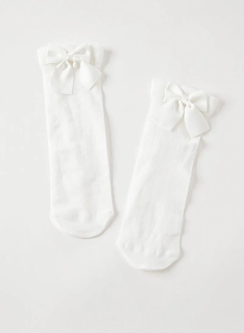 ديف اند بيلا جوارب  نايلون بيضاء بفيونكة